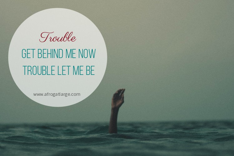 hand sticking out of a grey ocean, with the blog title 'trouble get behind me now, trouble let me be'